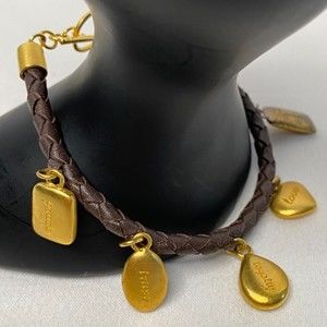 Leather Weave Bracelet With Gold Tone Charms Toggle Clasp